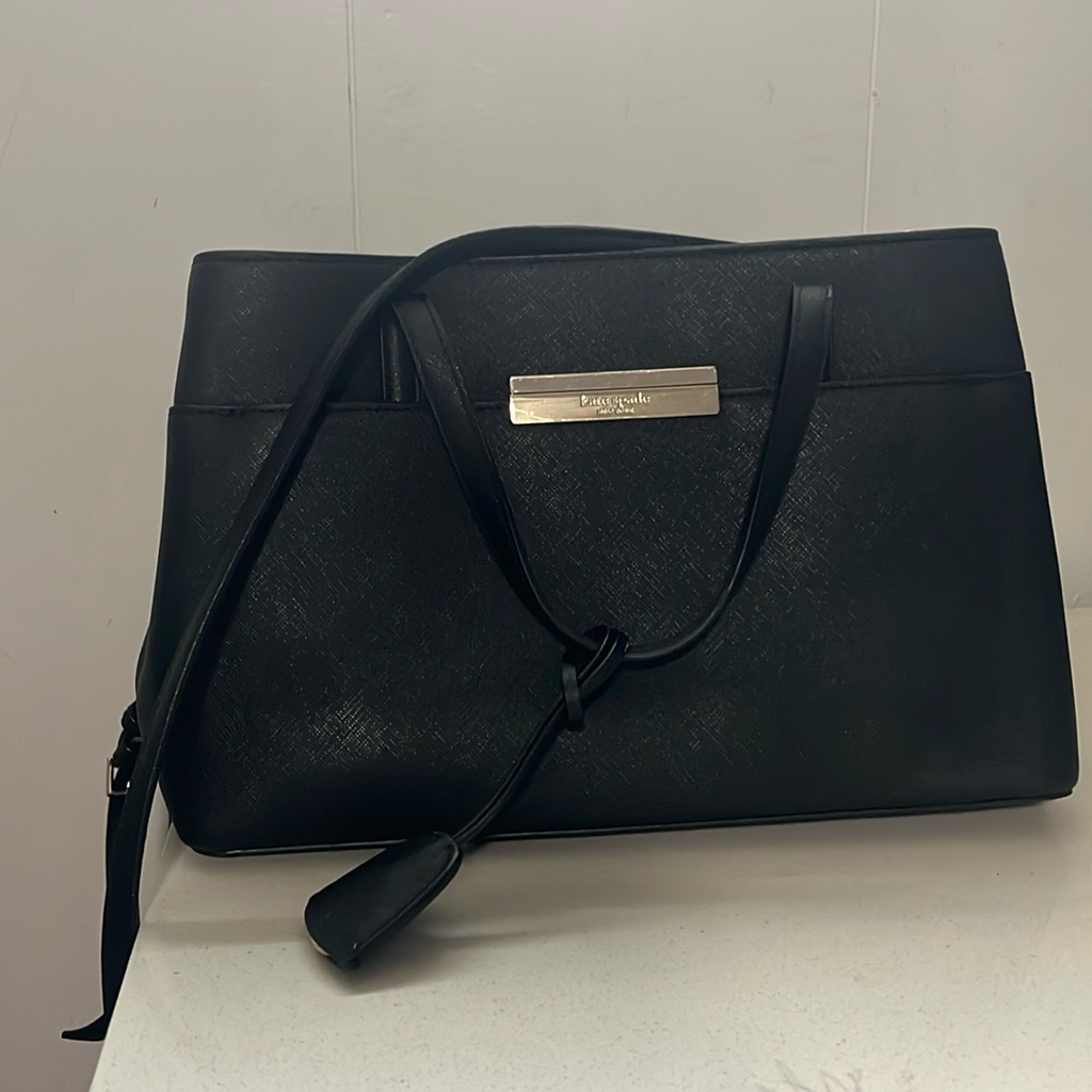 This Is A Kate Spade Satchel Medium , It’s Black And Chrome .